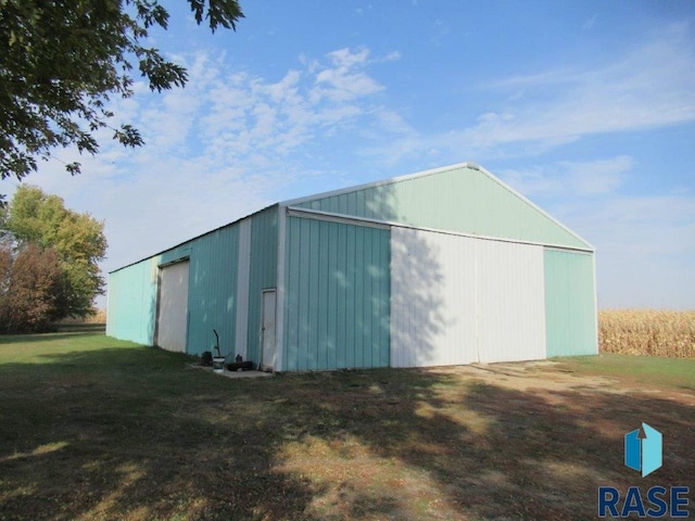 view of outbuilding with a lawn