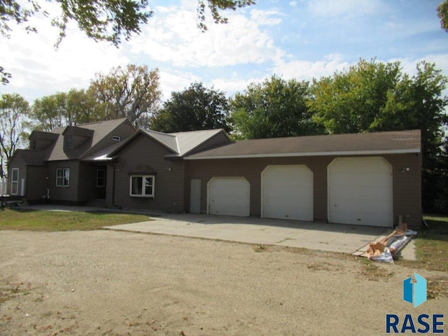 single story home with a garage