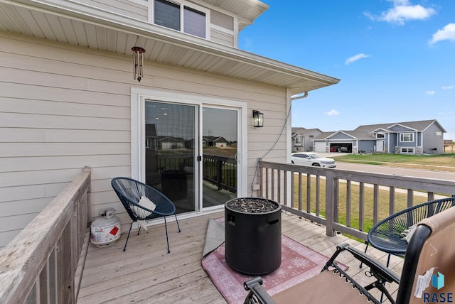 wooden deck featuring a yard