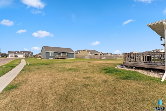 view of yard featuring a wooden deck