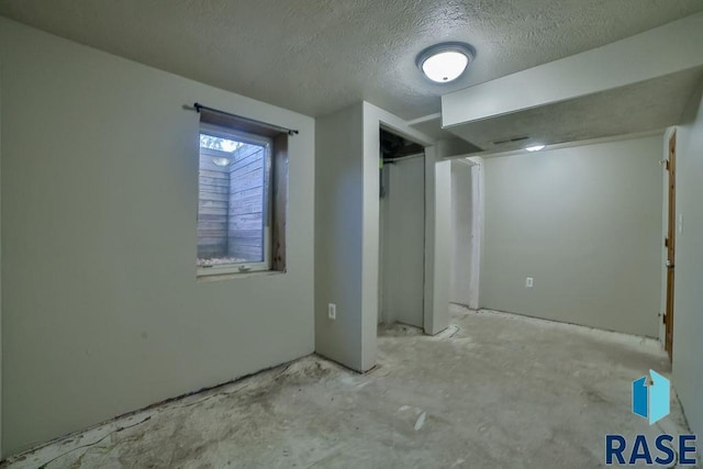 interior space with a textured ceiling