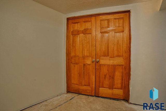 interior space featuring a textured ceiling