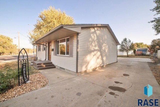 view of property exterior featuring a patio