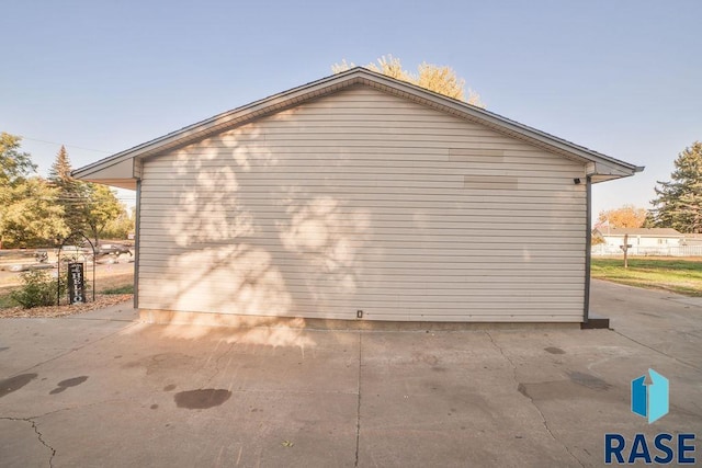 view of side of property featuring a patio area