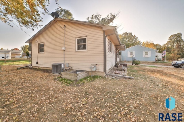 view of side of property with cooling unit