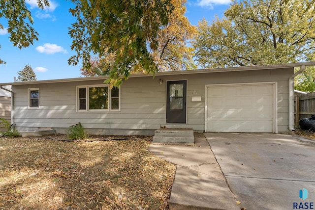 ranch-style home featuring a garage