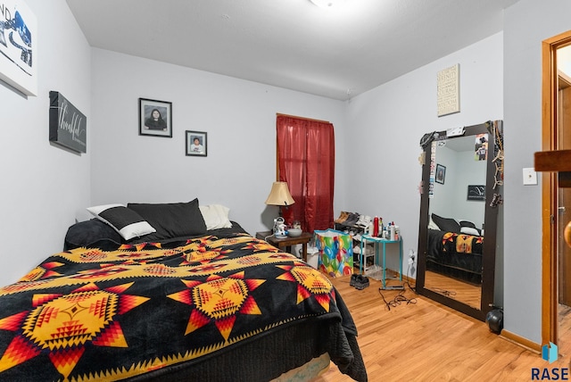 bedroom featuring wood-type flooring