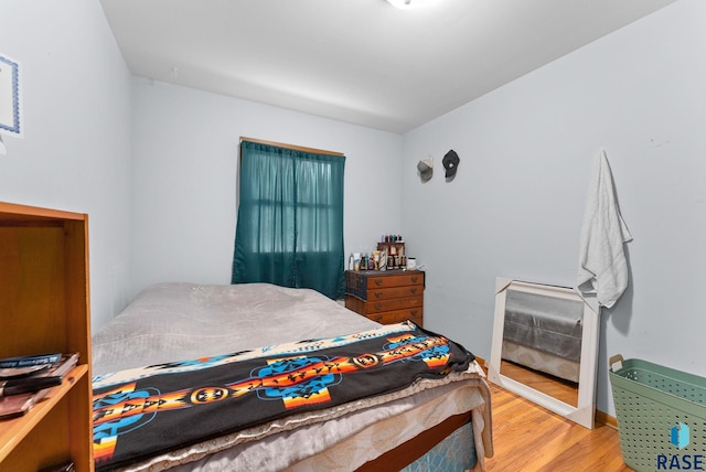 bedroom featuring hardwood / wood-style flooring