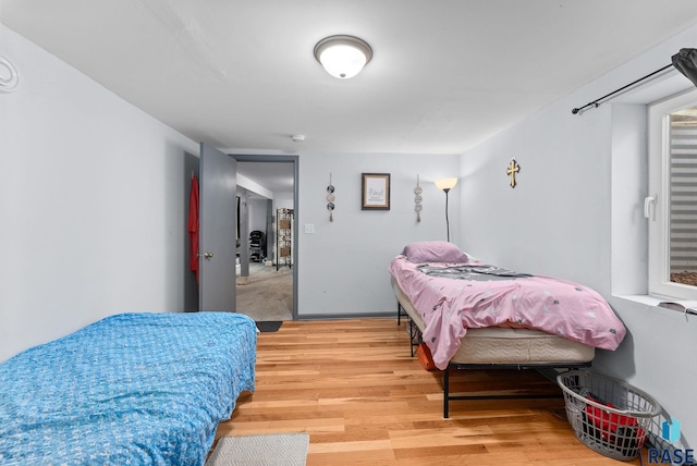 bedroom with wood-type flooring