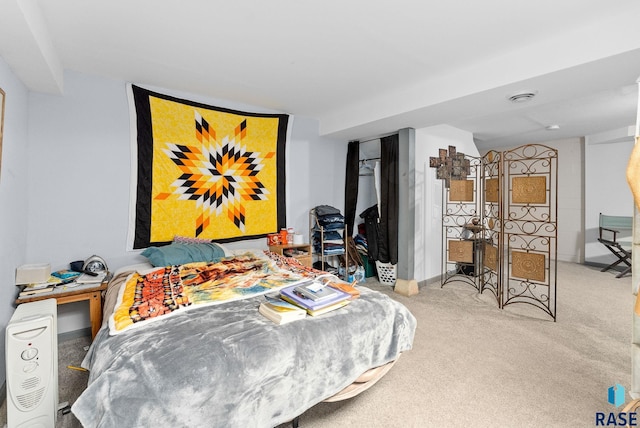 bedroom with light colored carpet