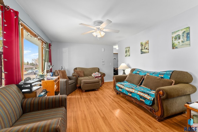 living room featuring ceiling fan and light hardwood / wood-style flooring