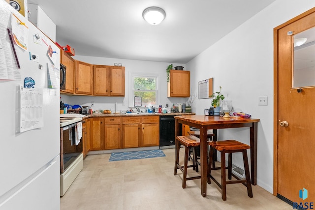 kitchen with black appliances and sink