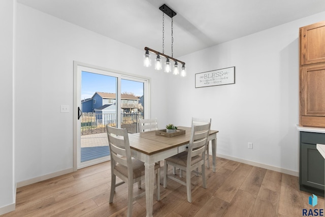 dining area with light wood-type flooring