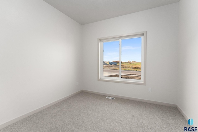 spare room featuring carpet floors