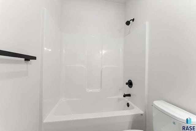 bathroom featuring toilet and tub / shower combination