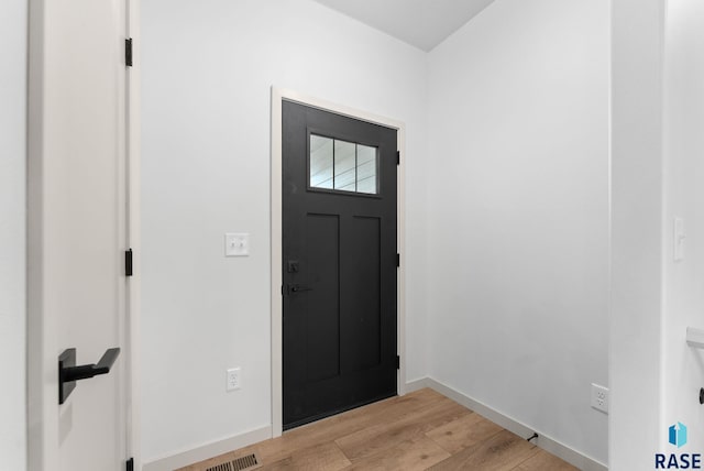 entrance foyer with light hardwood / wood-style flooring