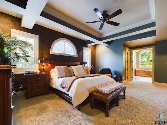 carpeted bedroom featuring beam ceiling, ceiling fan, ornamental molding, ensuite bathroom, and coffered ceiling