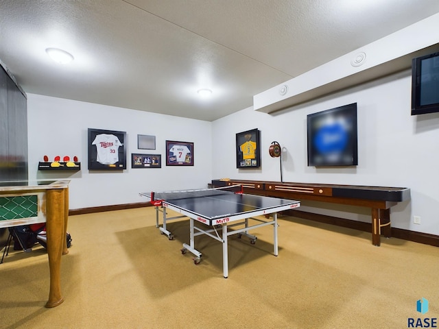 game room with carpet and a textured ceiling