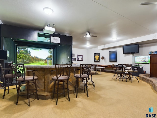 bar with carpet flooring and ceiling fan