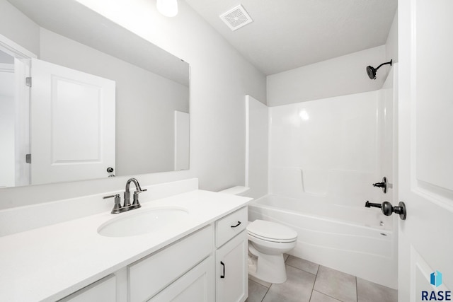 full bathroom featuring toilet, tile patterned flooring, shower / tub combination, vanity, and a textured ceiling