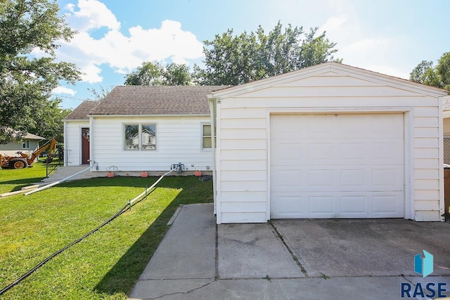 garage with a lawn