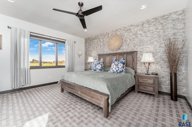 bedroom featuring light colored carpet and ceiling fan