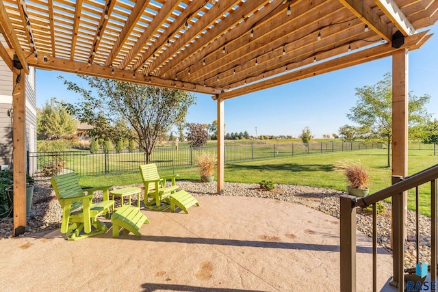 view of patio with a pergola and a rural view