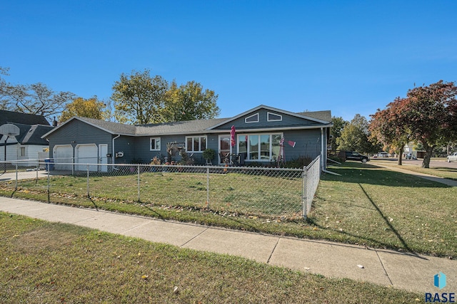 view of front facade with a front yard and a garage