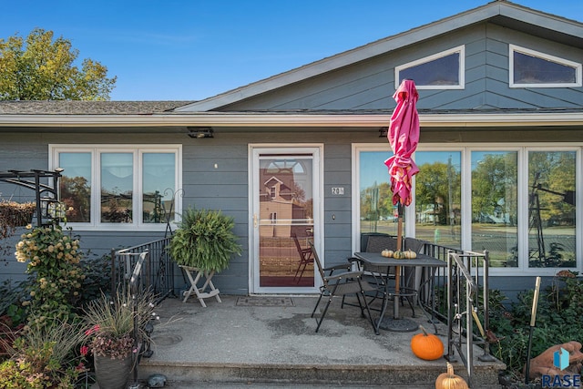 entrance to property with a patio