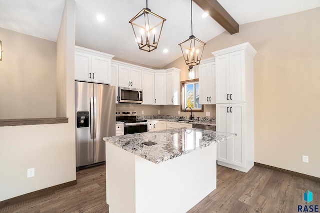 kitchen featuring white cabinetry, stainless steel appliances, lofted ceiling with beams, a kitchen island, and hardwood / wood-style flooring