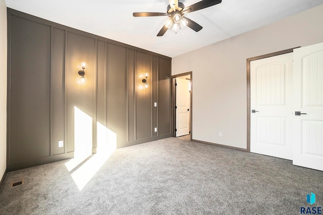 unfurnished bedroom featuring carpet flooring and ceiling fan