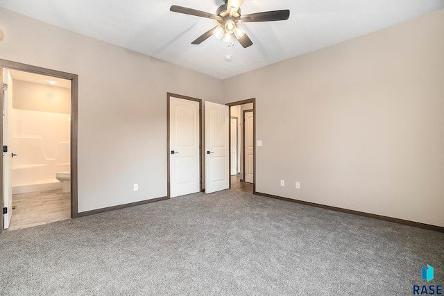 unfurnished bedroom with carpet, connected bathroom, and ceiling fan