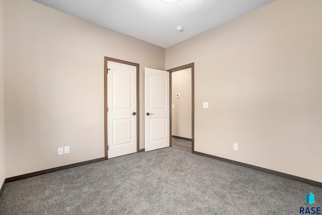 unfurnished bedroom with carpet floors