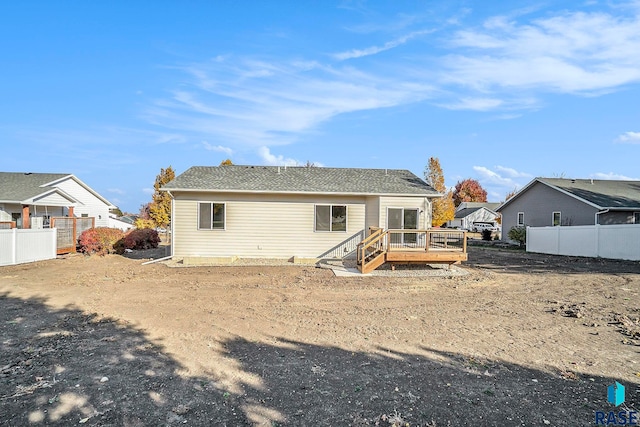 rear view of property with a deck