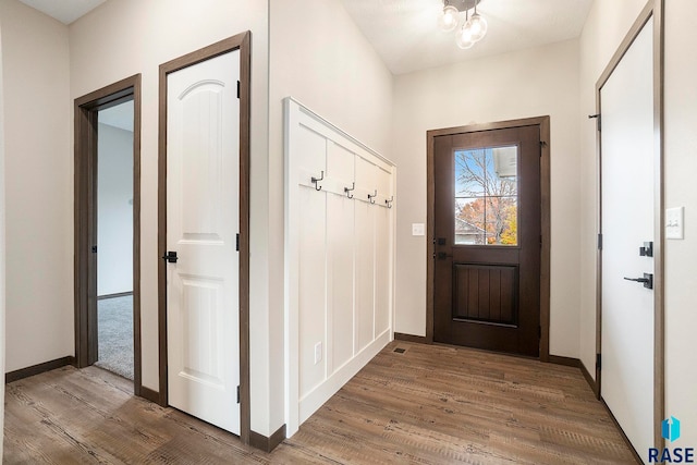 mudroom with wood-type flooring