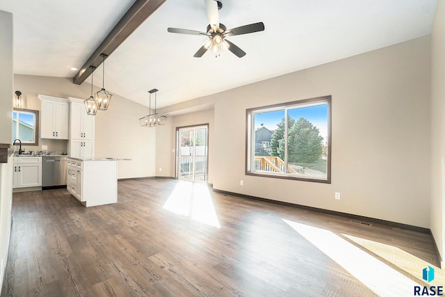 unfurnished living room with lofted ceiling with beams, dark hardwood / wood-style flooring, and ceiling fan with notable chandelier