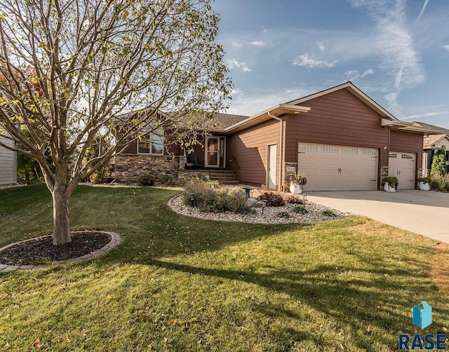 ranch-style house with a front yard and a garage