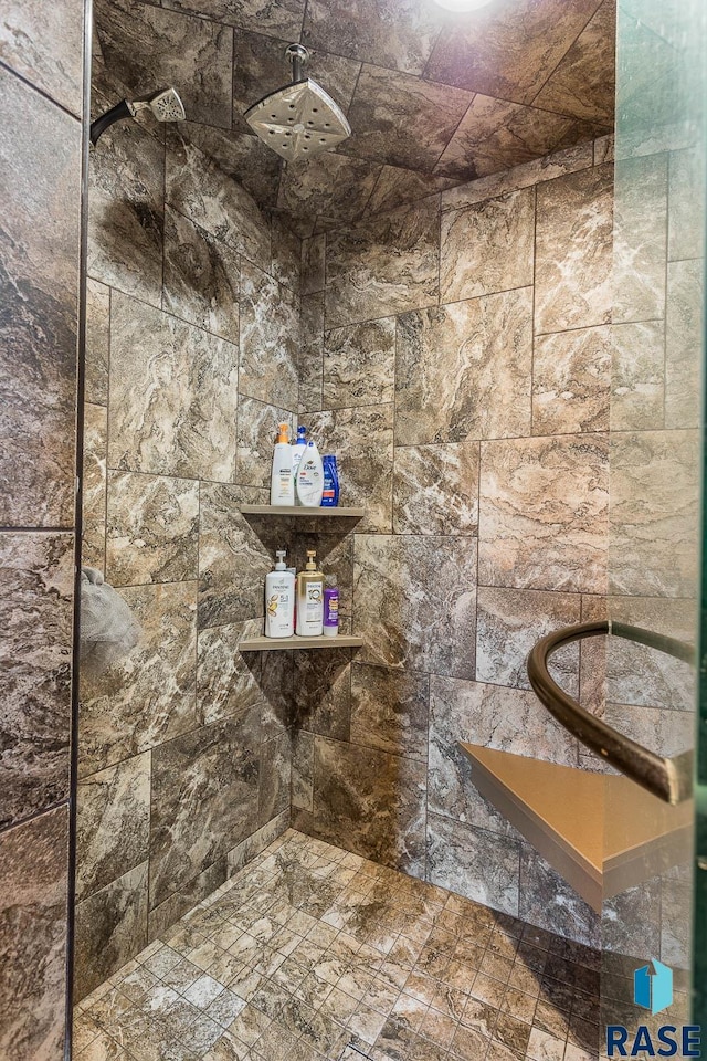 bathroom with a tile shower