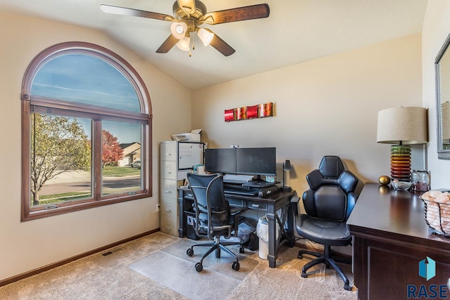 office featuring ceiling fan, light colored carpet, and vaulted ceiling