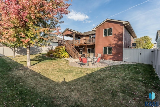 back of house with a patio, a deck, and a lawn