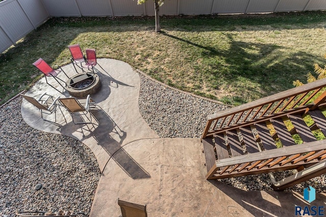 view of yard with an outdoor fire pit and a patio