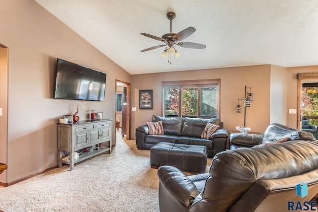 carpeted living room with lofted ceiling and ceiling fan