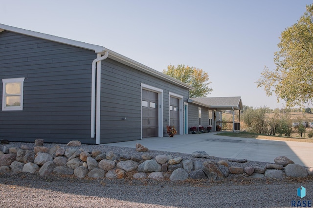 view of property exterior featuring a garage