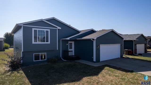 view of front of home with a garage and a front yard