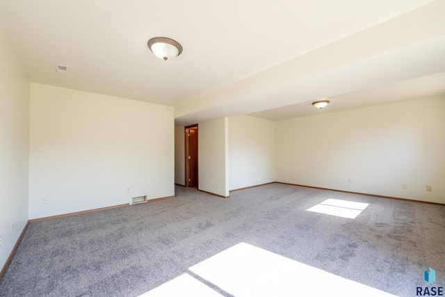 unfurnished room with light colored carpet