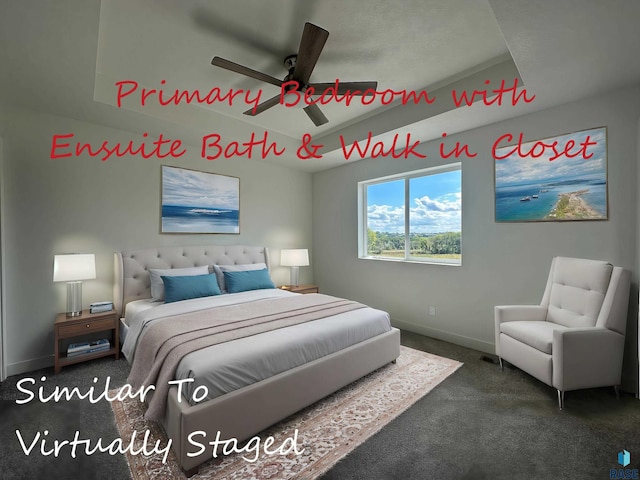 carpeted bedroom with a tray ceiling and ceiling fan