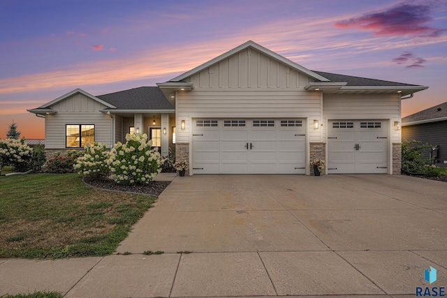 view of front of house with a lawn and a garage