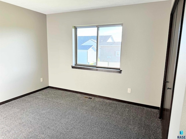 view of carpeted spare room