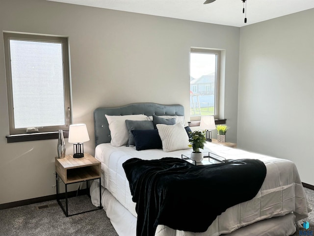 carpeted bedroom with ceiling fan