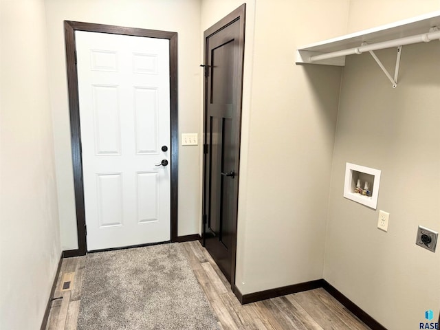 laundry room with light hardwood / wood-style flooring, washer hookup, and hookup for an electric dryer